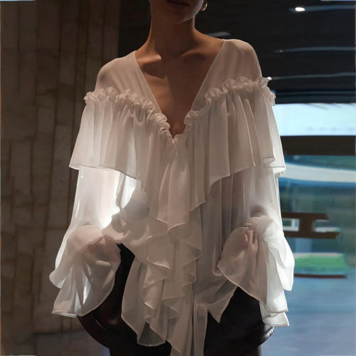 Blouse for women with voluminous ruffle details and an elegant button placket Amarae