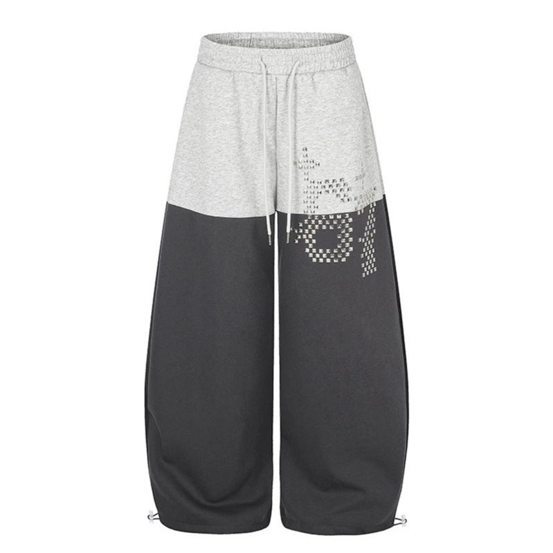 Women's Oversize Two-Tone Palazzo Sweatpants made of French Terry with logo studs, drawstring and adjustable hem.