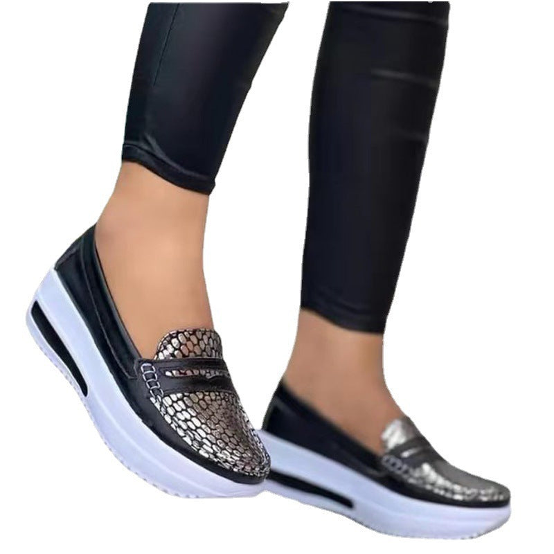 Women's comfortable Slip-On shoes with a stylish snake leather design and a cushioned sole Lune London