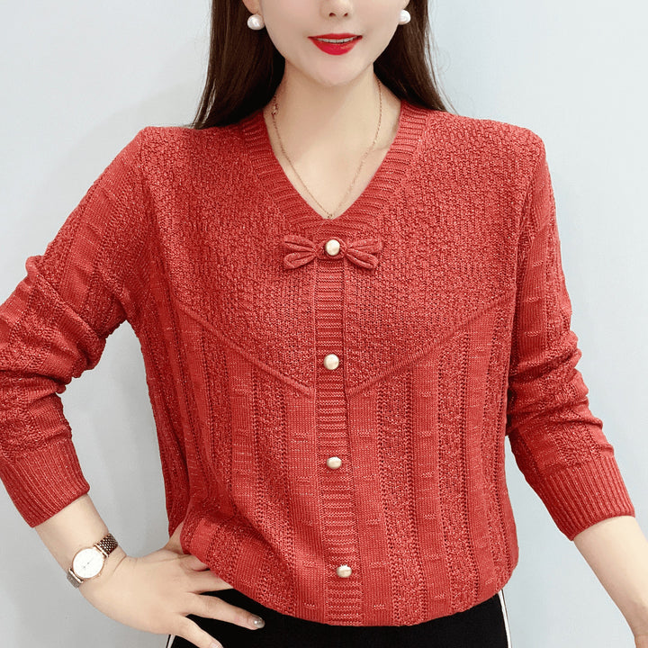 Women knit top with decorative pearl buttons and a refined bow design Lune London