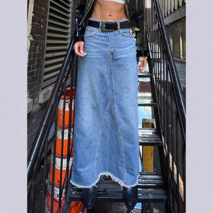 Ladies high-waisted denim maxi skirt with straight cut, decorative seams and raw fringe hem Amarae
