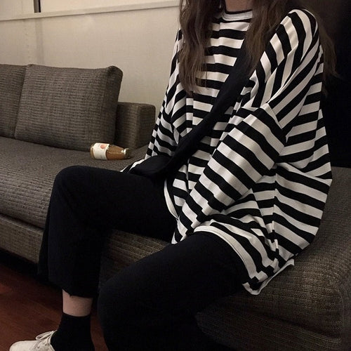 Women's striped long-sleeve shirt with a loose fit and modern details