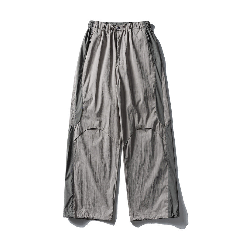 Men's loose technical nylon cargo pants with elastic waistband and panel details Amarae