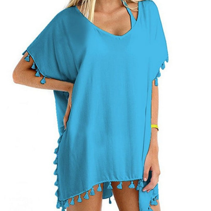 Tuniques de plage pour femmes avec une structure aérienne et des pompons ludiques Chic & Stil