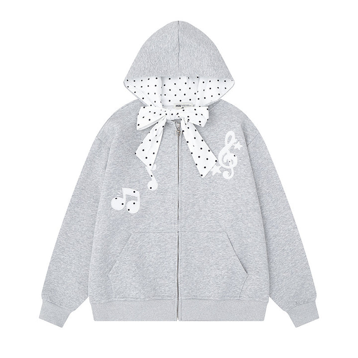 Women's hooded sweat jacket with polka dot hood lining, decorative bow, and music notes motif Amarae