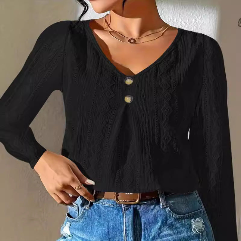 Women's blouse with decorative buttons and textured fabric Amarae