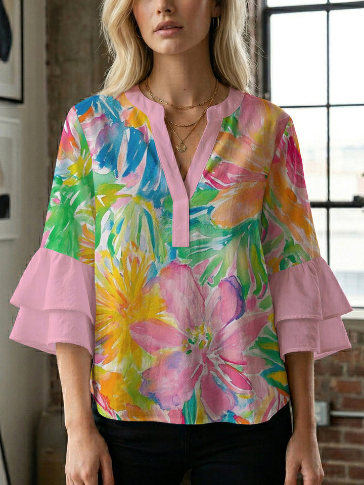 Women’s blouse with voluminous ruffled sleeves and floral pattern Lune London
