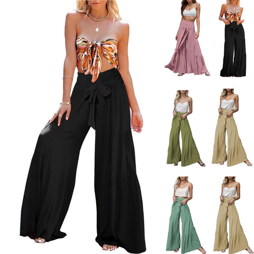 High-waisted wide trousers for women with elegant pleats and a tie belt Amarae