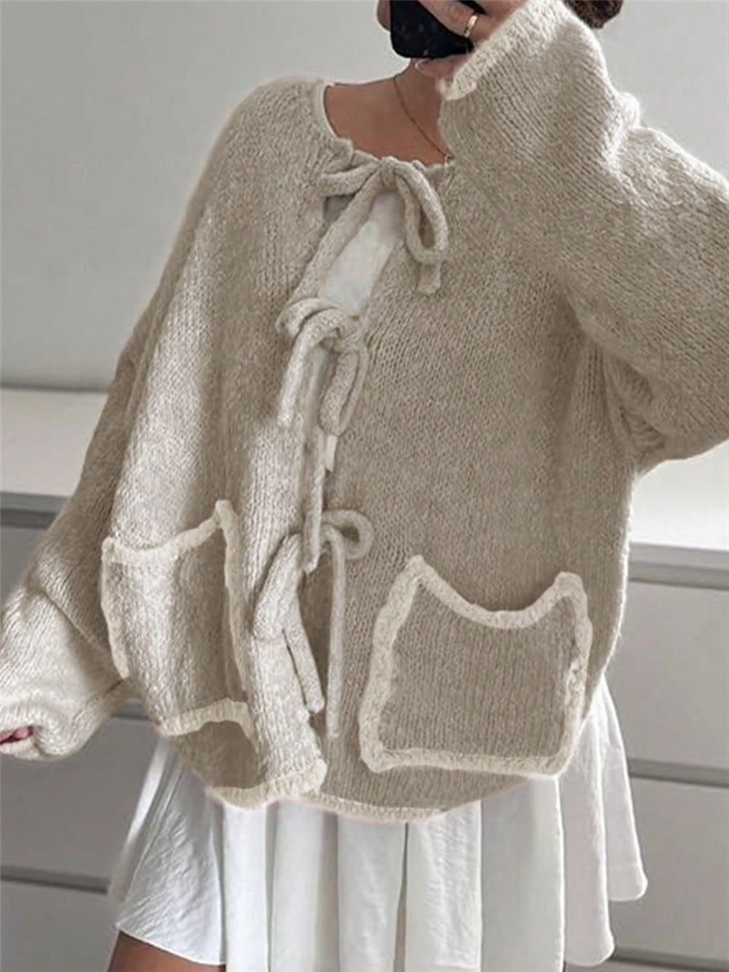 Ladies casual knit jacket with a unique tie detail and large pockets Lune London