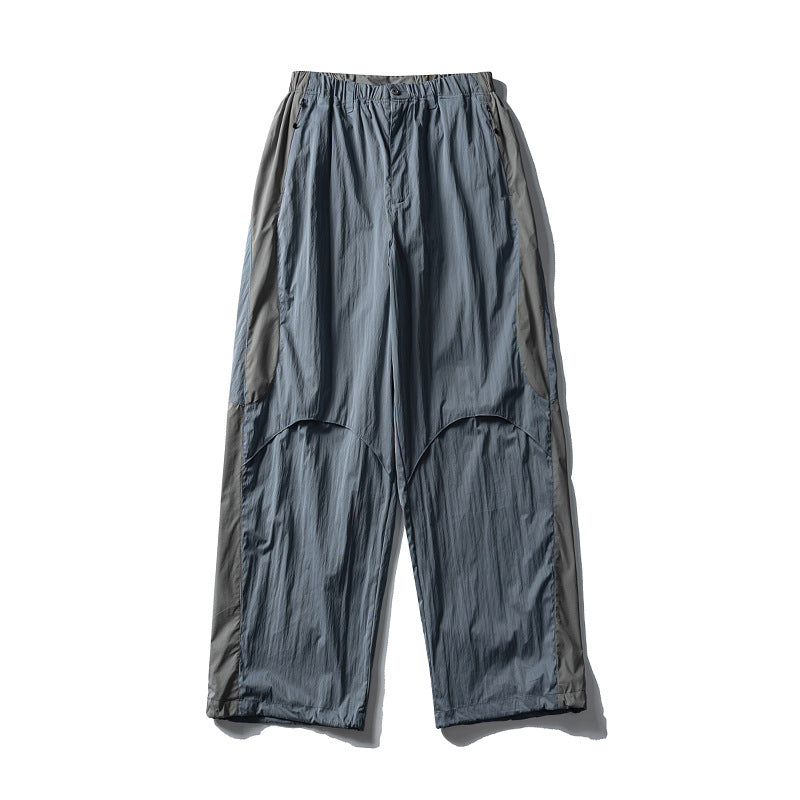 Men's loose technical nylon cargo pants with elastic waistband and panel details Amarae