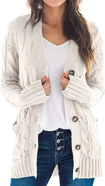 Knitted women's pullover with a structured cable pattern and practical pockets Lune London