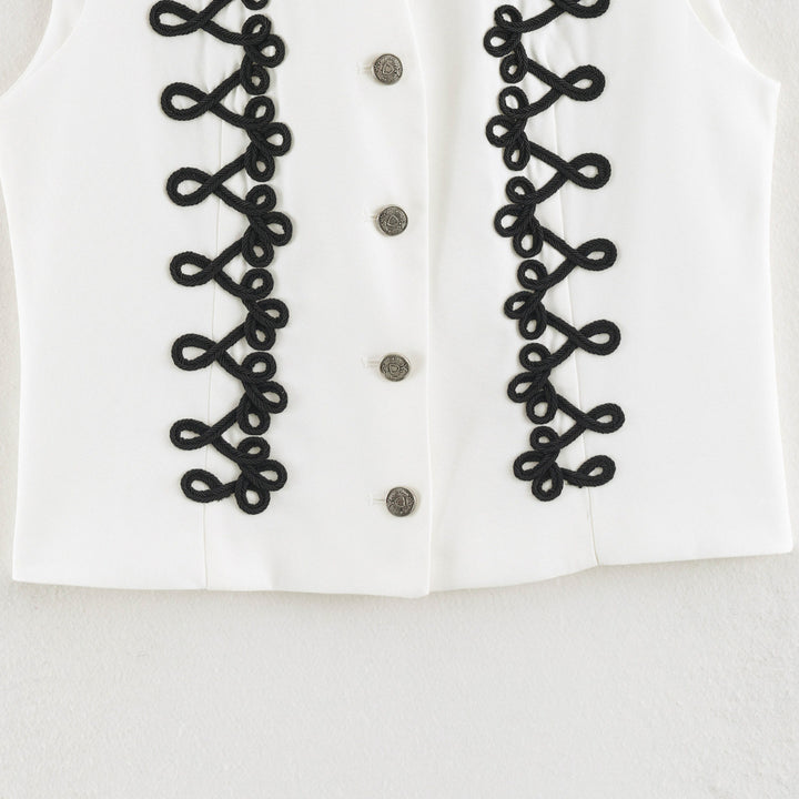 Women's sleeveless vest in uniform style with decorative frog closures and stand-up collar Amarae