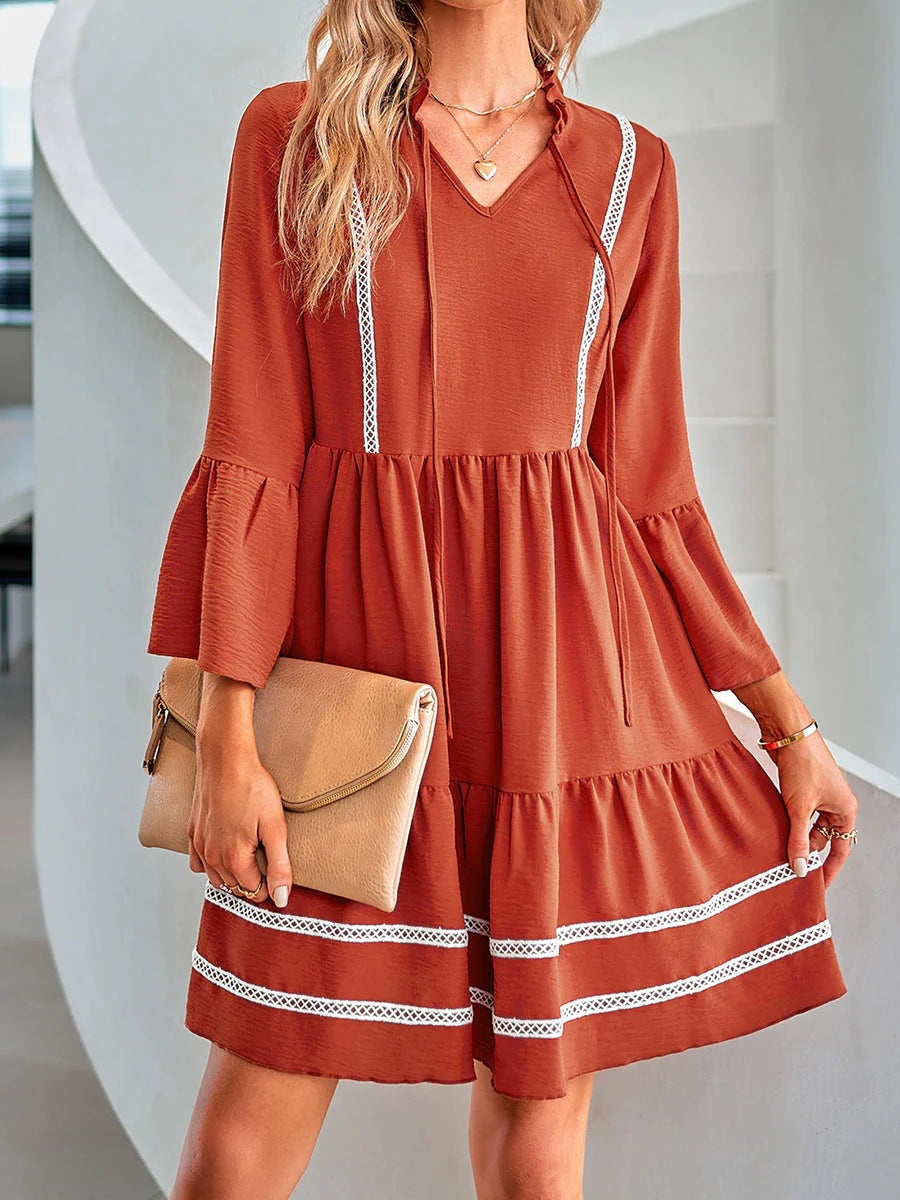 Casual mini dress for women with V-neck, decorative sleeve cuffs and playful hem Lune London