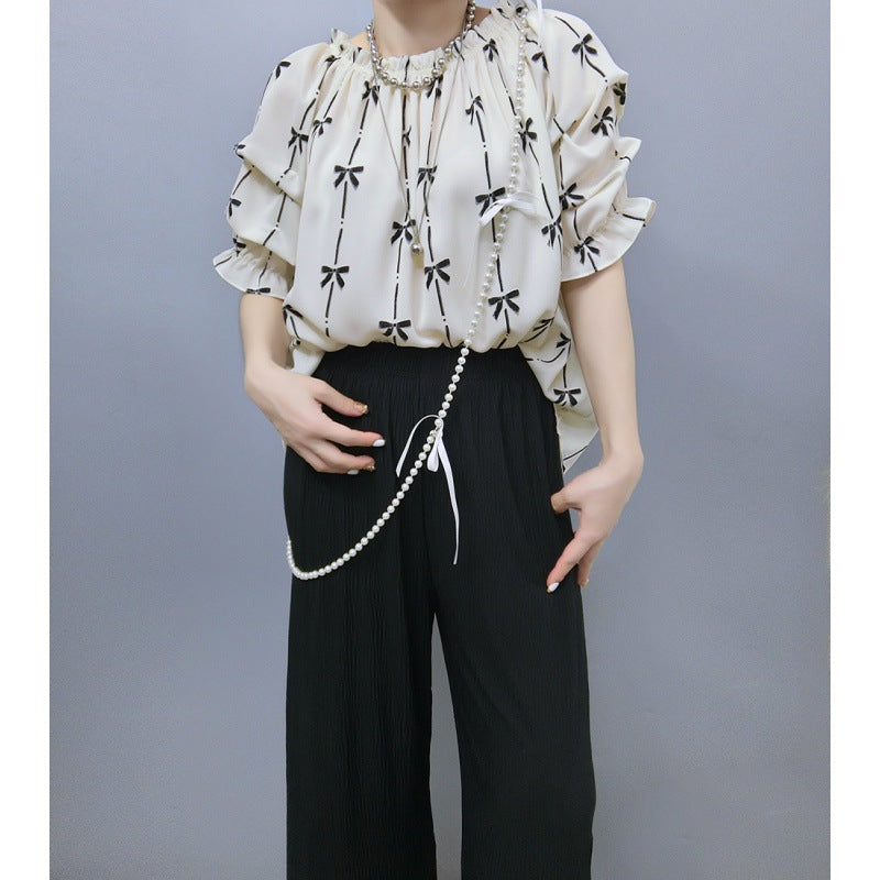 Blouse for women with ruffled sleeves and bow pattern Lune London