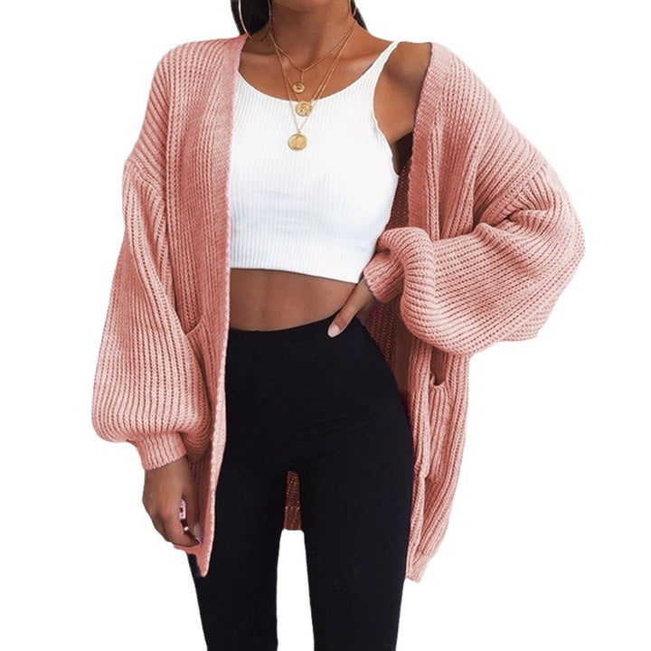 Ladies chunky knit cardigan with relaxed oversized fit and chic puffed sleeves