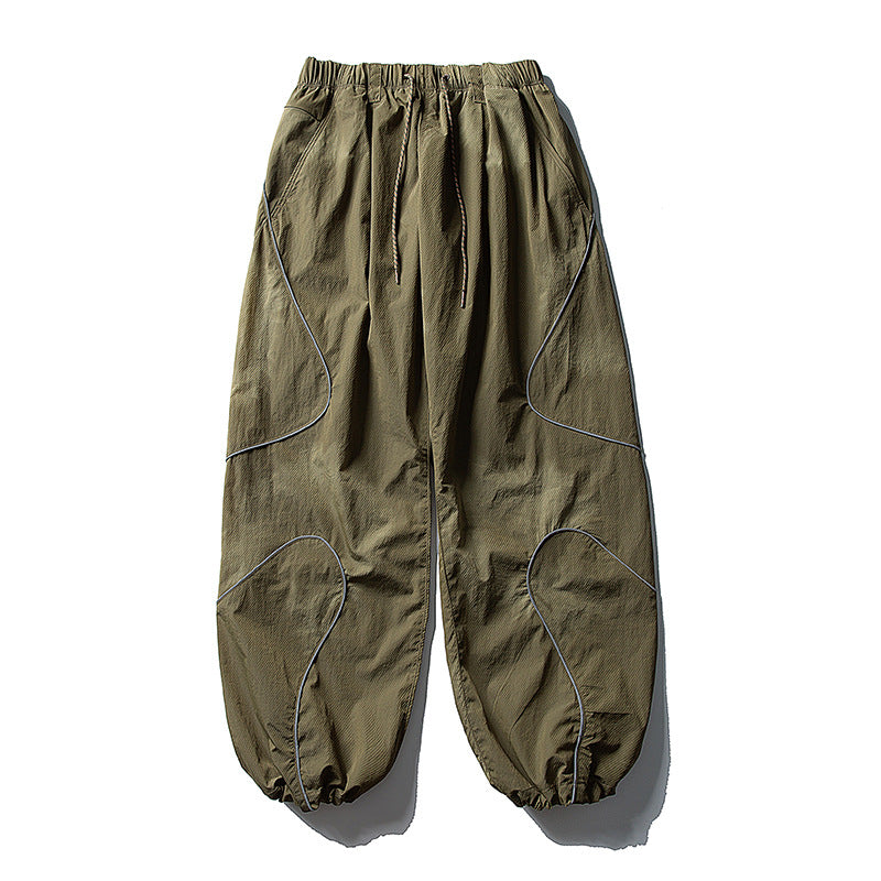 Men's loose utility harem pants made of ripstop with drawstring waistband, shaped panels, and elastic ankle cuffs Amarae