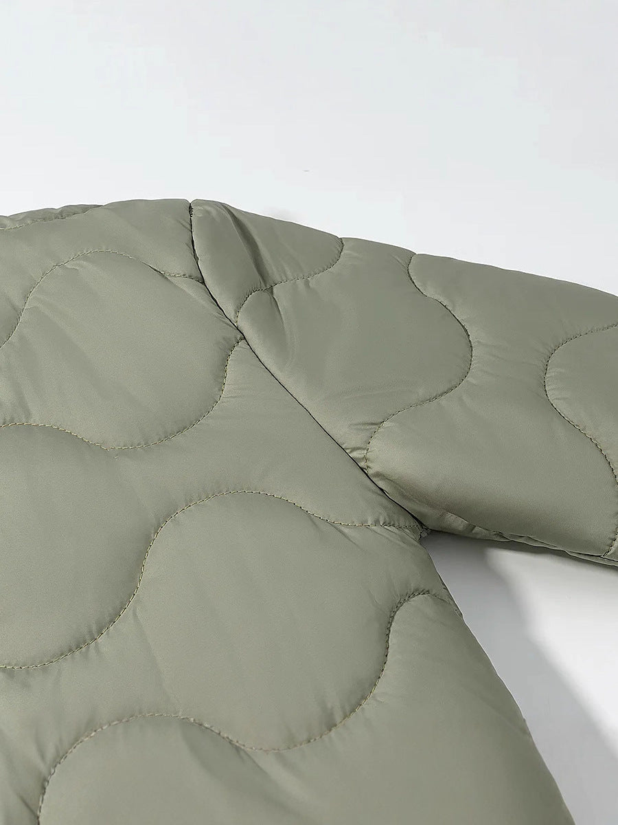 Quilted transition jacket for women with a soft fabric texture and practical snap buttons Lune London