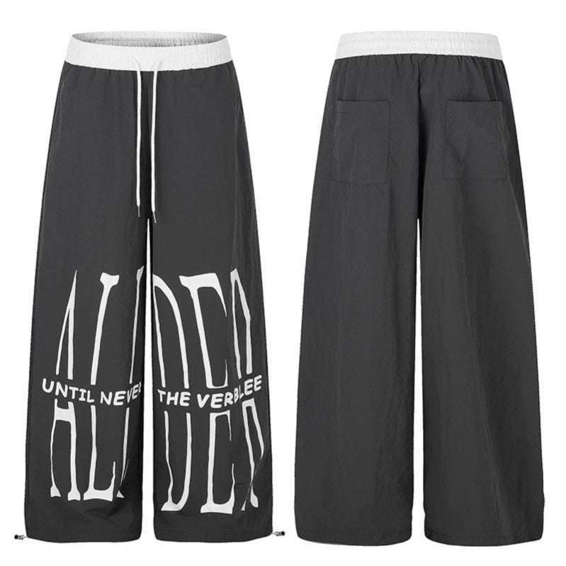 Women's wide loungewear pants with high comfort waistband, drawstring, adjustable hem, and typographic print Amarae
