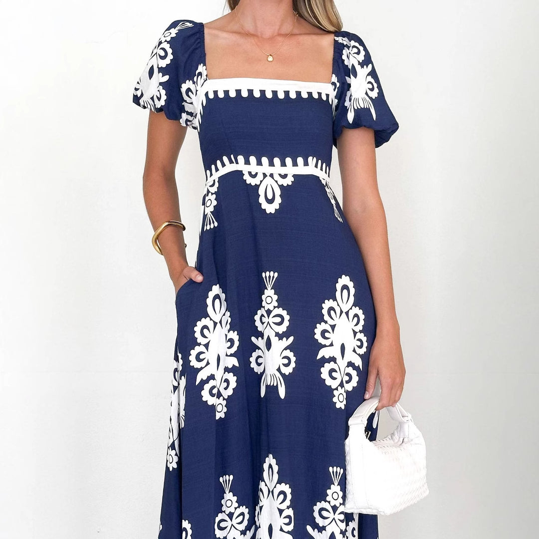 Women's maxi dress with elegant ruffle details and floral pattern Lune London