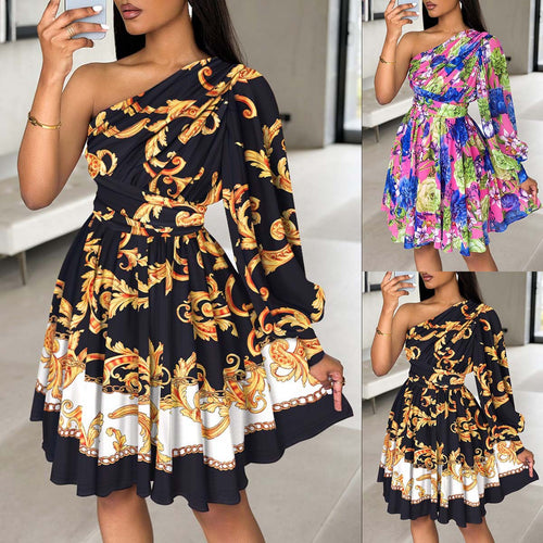 Women's dress with one shoulder, voluminous sleeves and a chic floral design