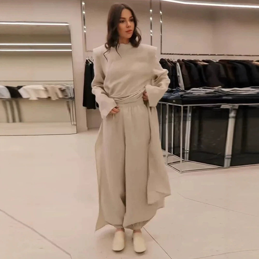 Women’s maxi dress with tailored silhouette, flared skirt and striking shoulders Amarae