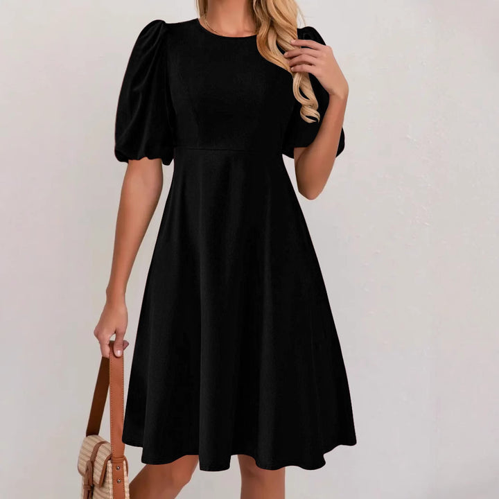 Puff sleeve dress for women with a flowing cut and waist accentuation Lune London