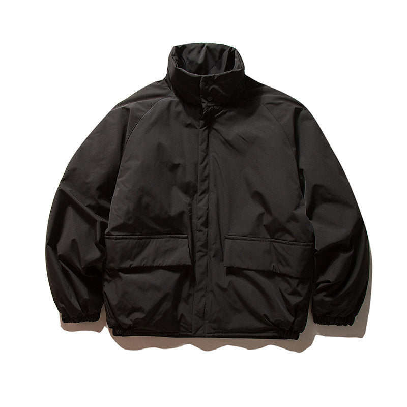 Unisex Boxy Padded Transition Jacket with High Stand-Up Collar, Elastic Cuffs and Flap Pockets Amarae