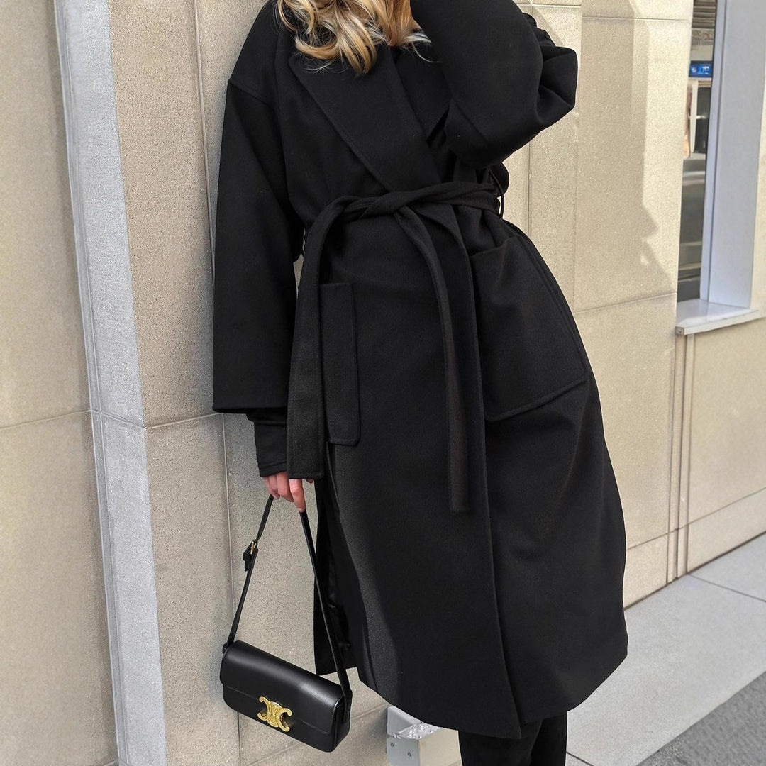 Elegant transitional coat for women with wide lapels and belt detail Lune London