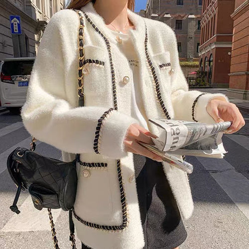 Ladies fashionable cardigan with stylish contrasting seams and chic button details