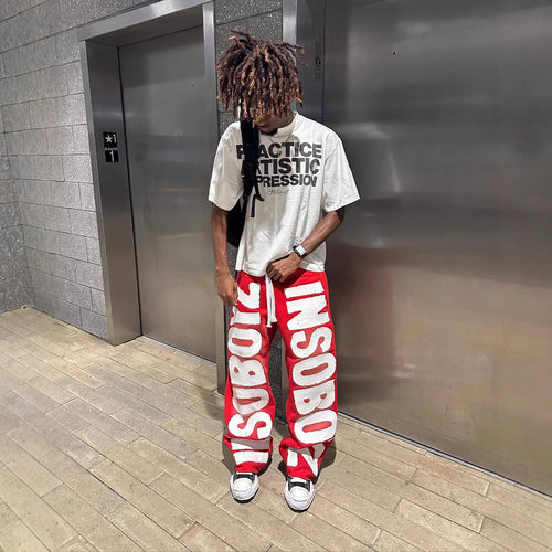 Women's casual pants with trendy statement print Chic & Stil