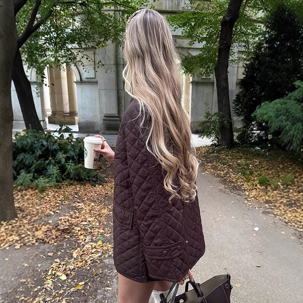 Women's oversized quilted jacket in coat style with snap button placket and patch flap pockets Amarae