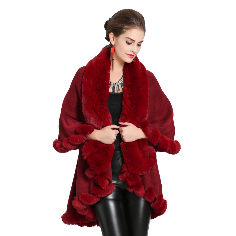 Ladies hooded poncho with luxurious fur collar and elegant trim Lune London