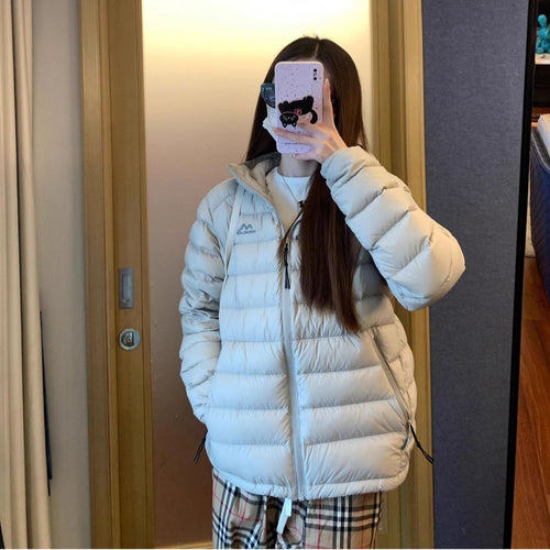Women's quilted winter jacket with high collar and practical side pockets