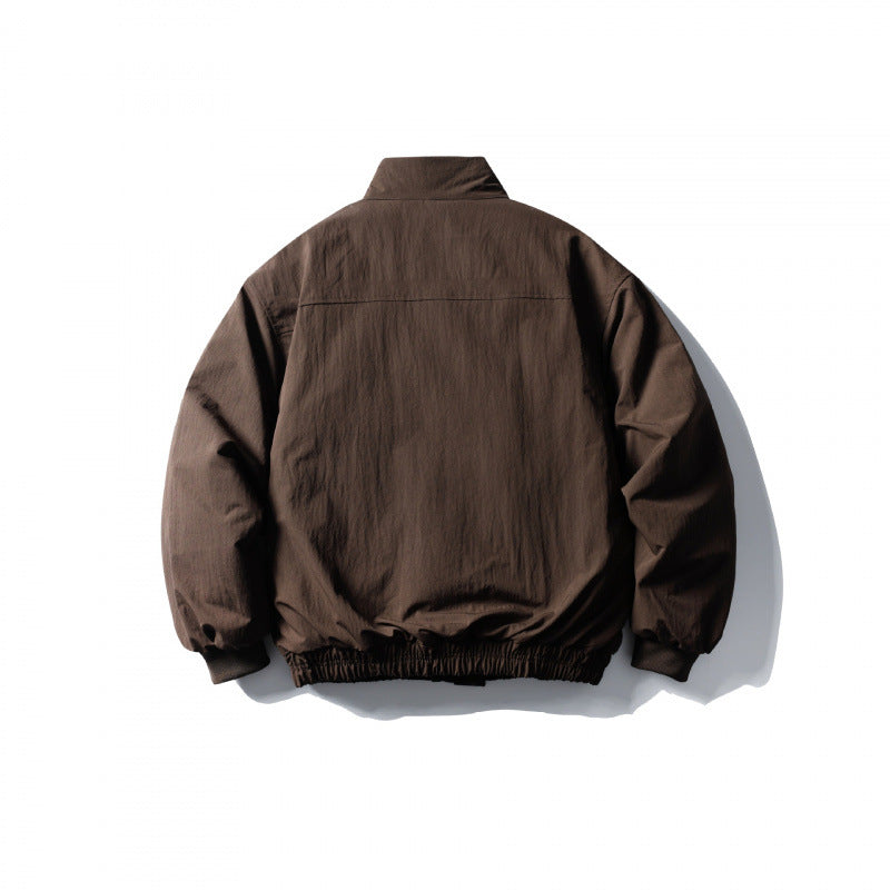 Unisex short boxy isolation jacket with diagonal flap pocket detail and elastic hem Amarae