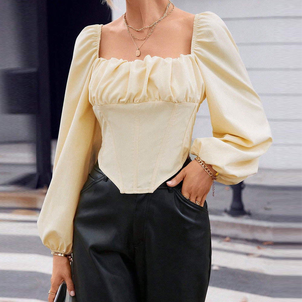 Blouse en dentelle pour femmes avec manches bouffantes et silhouette cintrée Chic & Stil