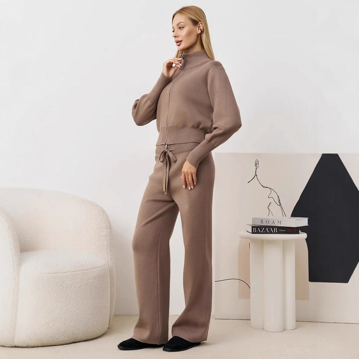 Ladies comfortable knit jumpsuit with high collar and side lace details Lune London