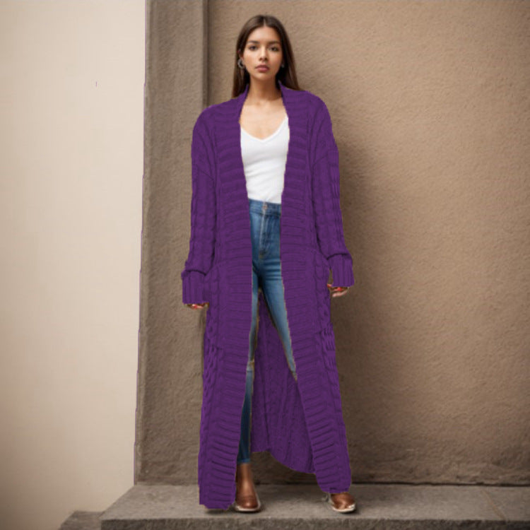 Women Thick knitted cardigan with a refined cable design and practical pockets Lune London