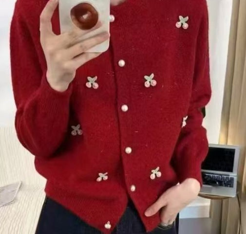 Women's knit jacket with a playful design and chic pearl buttons