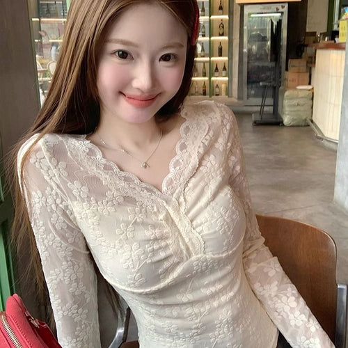 Women's lace blouse with V-neck and ruffle details Chic & Stil