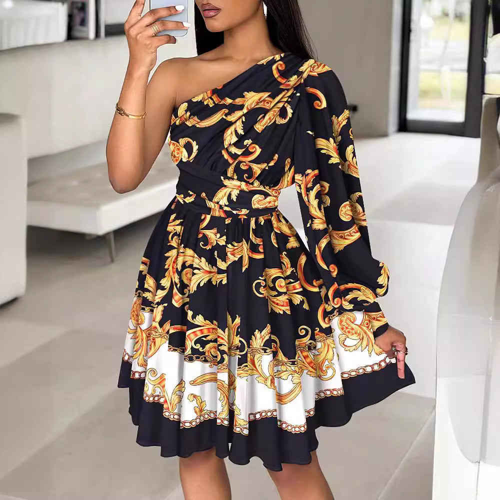 Women's dress with one shoulder, voluminous sleeves and a chic floral design