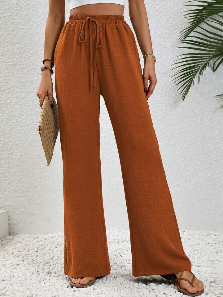 Pantalons larges d'été pour femmes avec taille élastique et poches latérales pratiques Chic & Stil