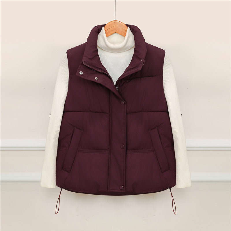 Sporty quilted vest for women with high collar and practical pockets Lune London