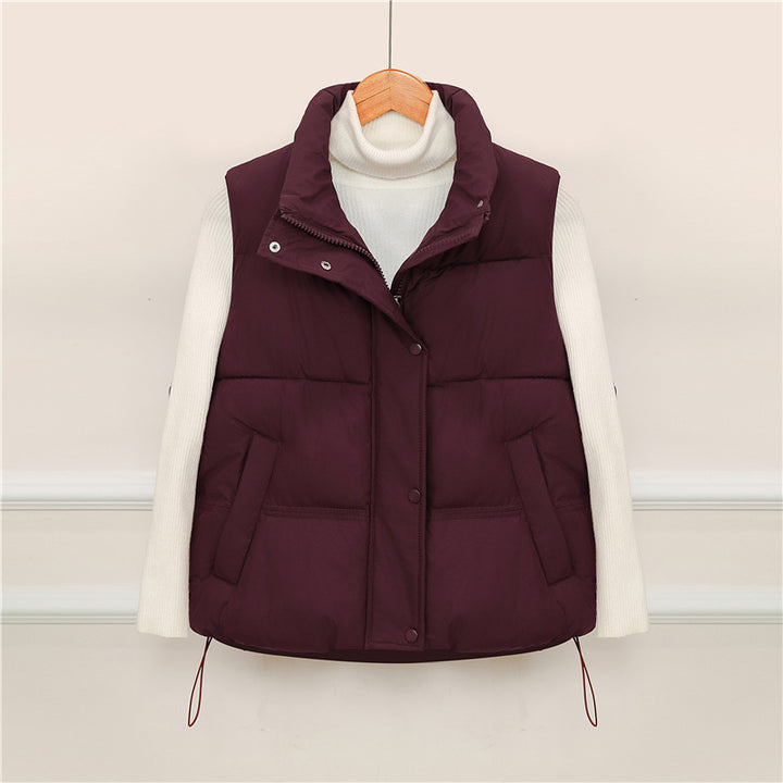 Sporty quilted vest for women with high collar and practical pockets Lune London