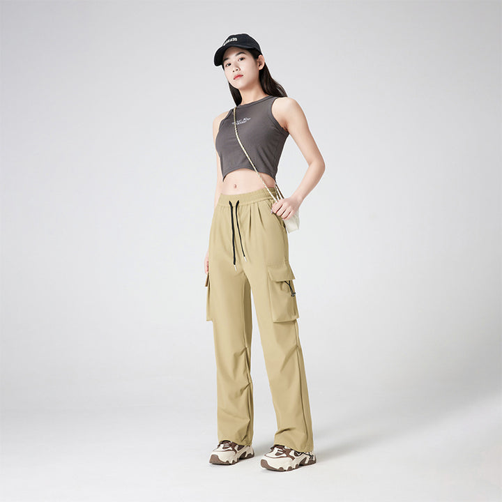 Women’s cargo pants in outdoor style with drawstring waistband, large side pockets, and adjustable hem.