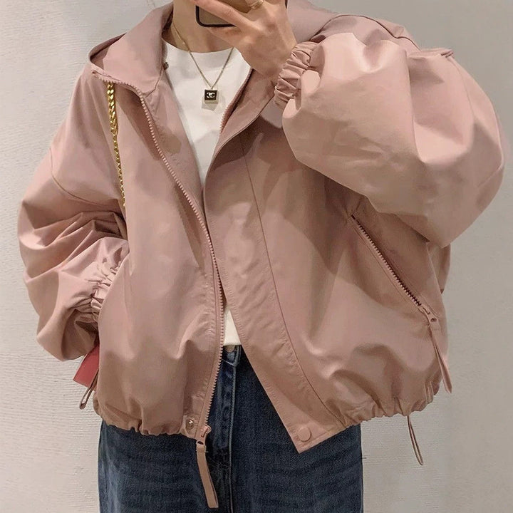 Women's oversized bomber-style hooded jacket with drawstring, elastic cuffs, and side zip pockets Amarae
