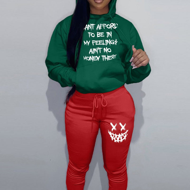 Casual women’s outfit with hoodie and jogger pants, featuring unique writing and creative patterns Lune London