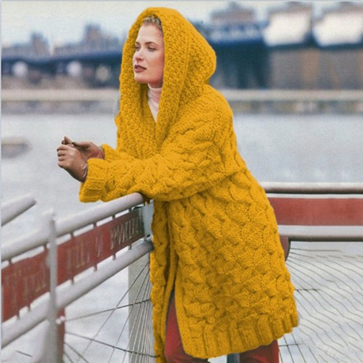 Thick knitted coat for women with hood and decorative cable knit pattern Lune London