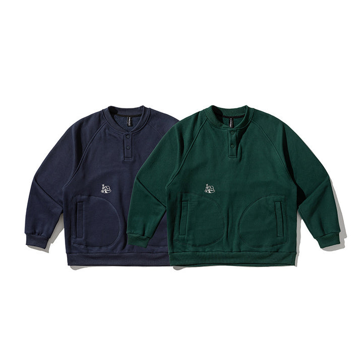 Unisex Oversize Henley Sweatshirt with raglan sleeves, button placket, and distinctive round pockets Amarae