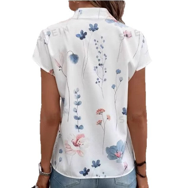 Women’s blouse with floral pattern and cape sleeves Lune London