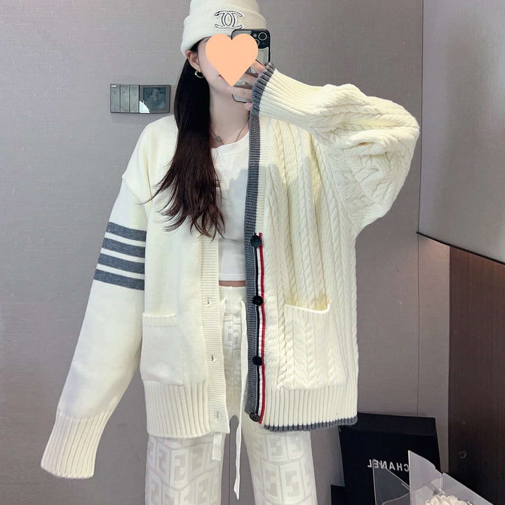Women's chunky knit cardigan with cable pattern and generous pockets Lune London